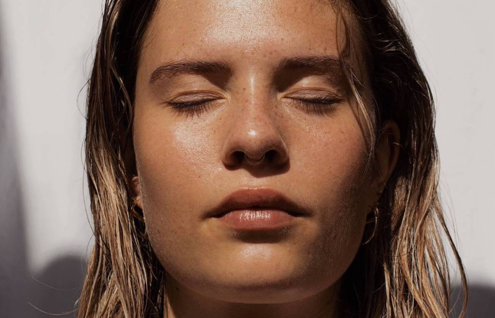 face of a blonde woman in the sun